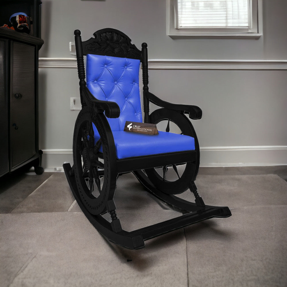 A blue upholstered rocking chair with a black frame and a plush backrest, positioned in a room near a window.